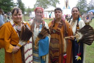 Four traditional dancers at the Silver Lake Pow Wow, l-r, Donna Mitchell, Kim Lanoue, Buffie John and Janice Knapp